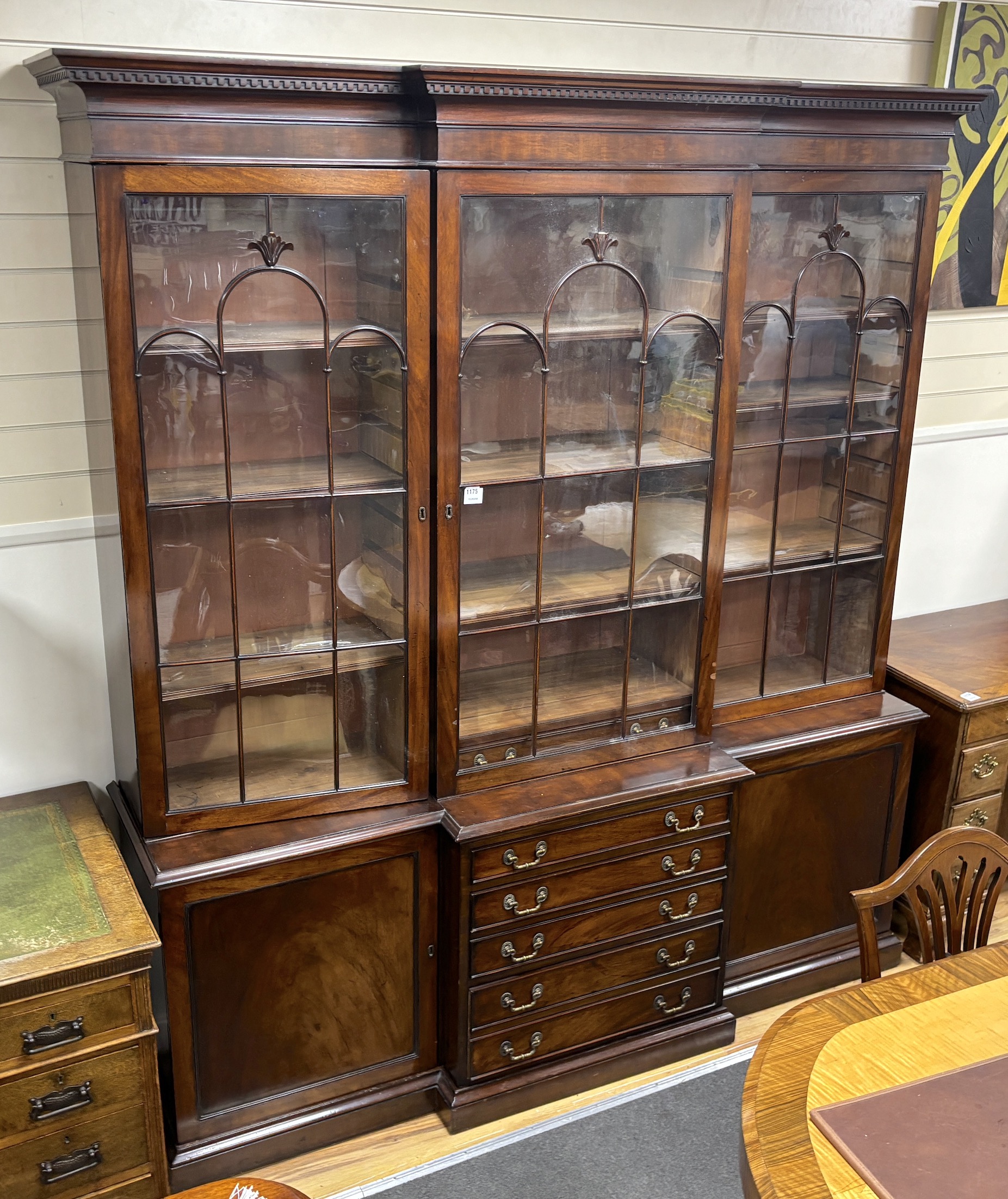 A George III style mahogany breakfront library bookcase, width 193cm, depth 52cm, height 220cm